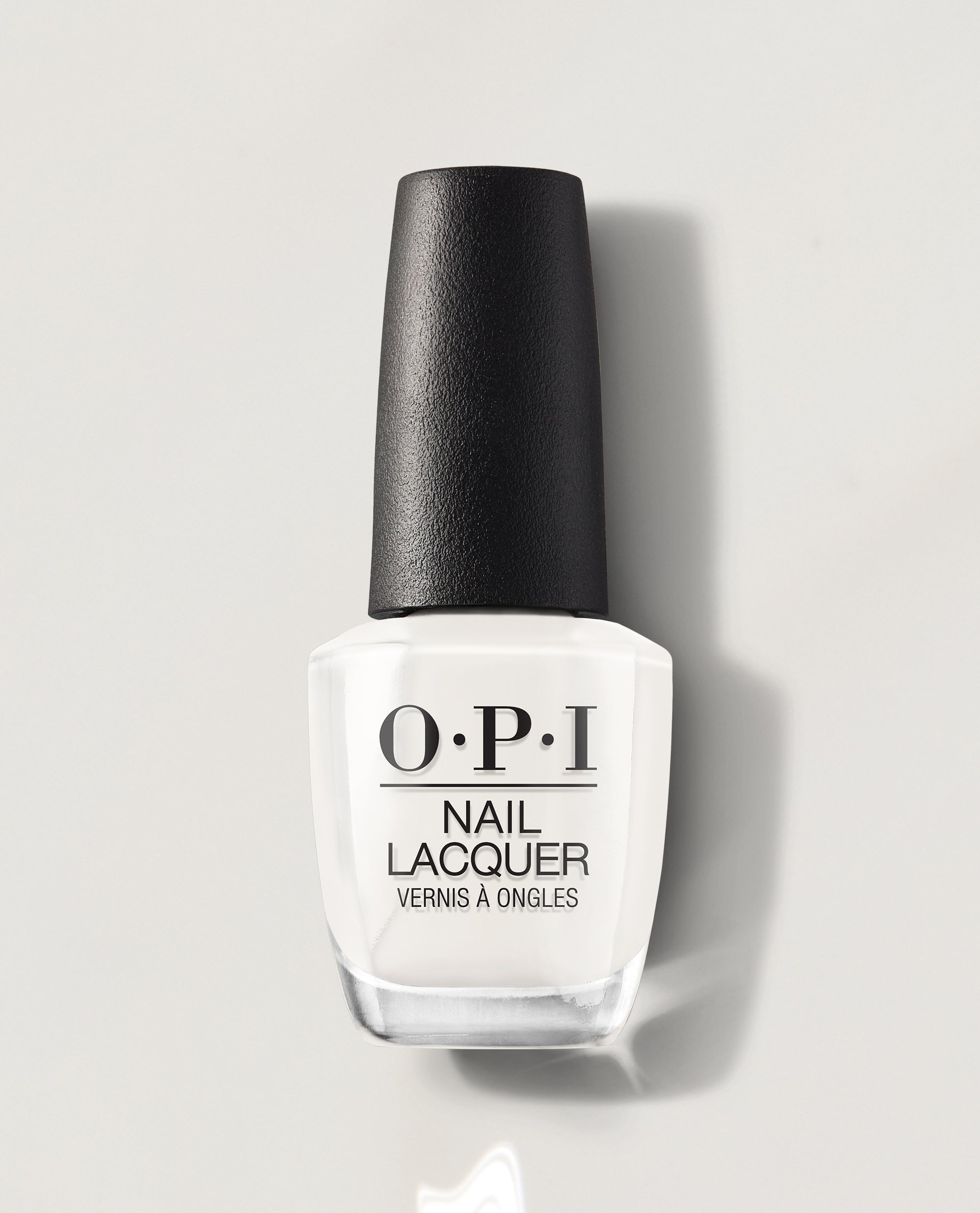 OPI Funny Bunny nail lacquer bottle standing upright, showing its creamy soft white nail polish color and black textured cap on a light gray background, ideal as an elegant OPI nail polish gift set shade for manicures and pedicures.