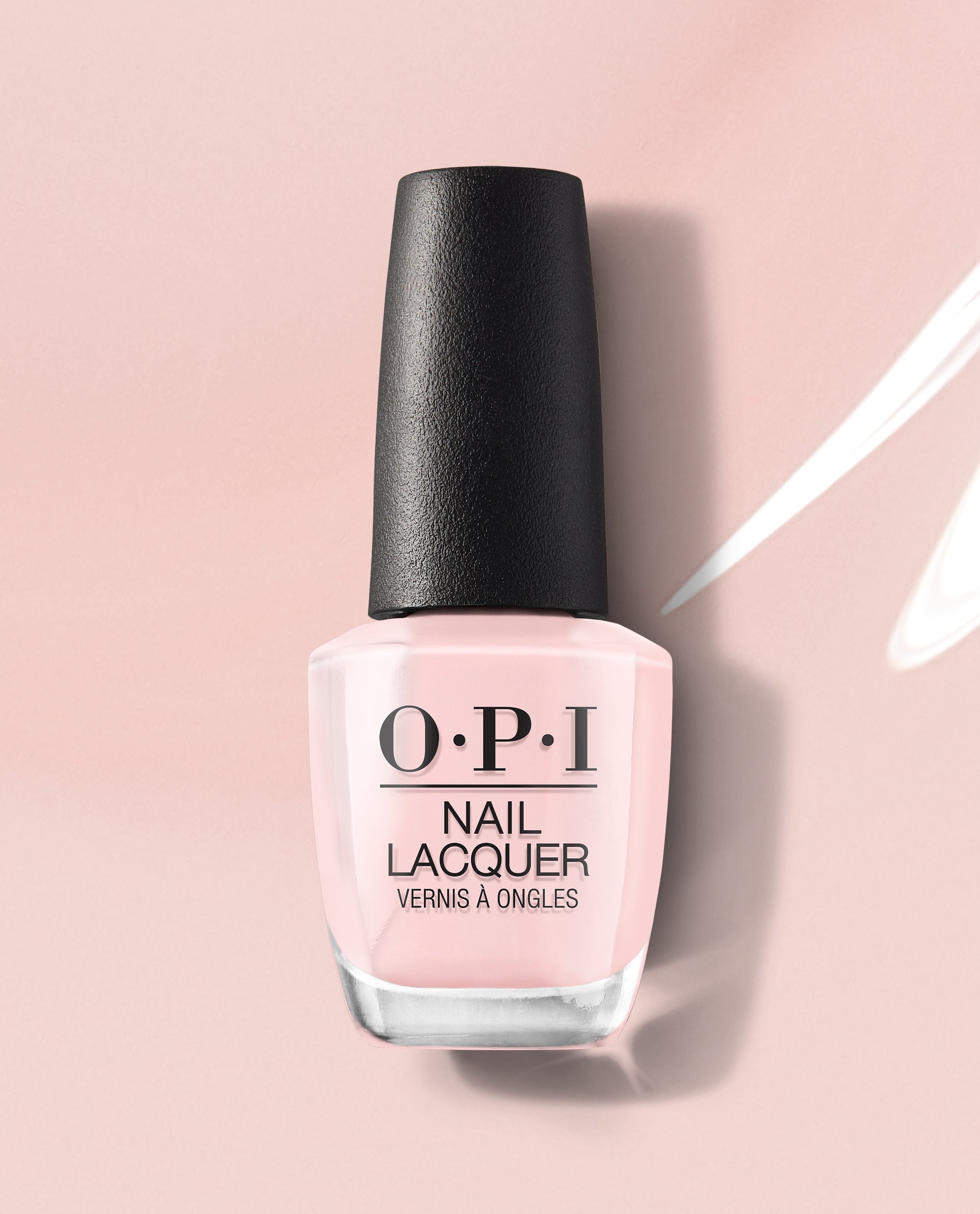 OPI Put it in Neutral nail lacquer bottle standing upright, showcasing its soft pink nude shade and black cap on a glossy blush background, ideal as a subtle nail polish gift set color for everyday wear.